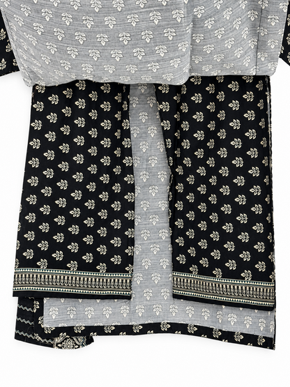 Black and ivory botanical print suit back and hem detail