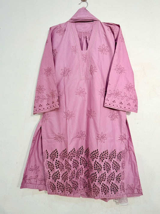 Pink embroidered traditional outfit on a white background