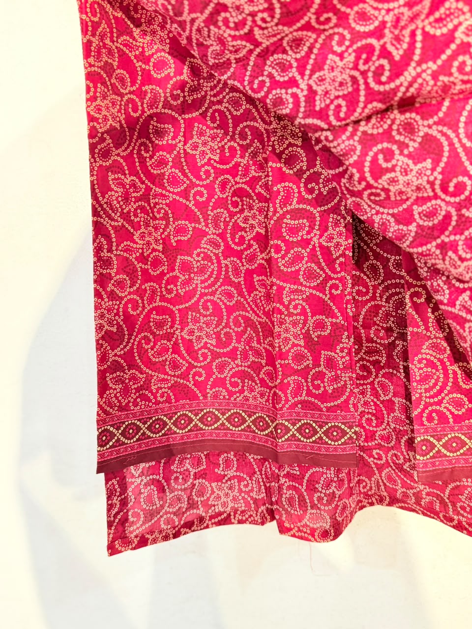 Bandhani print fabric close-up with border detail