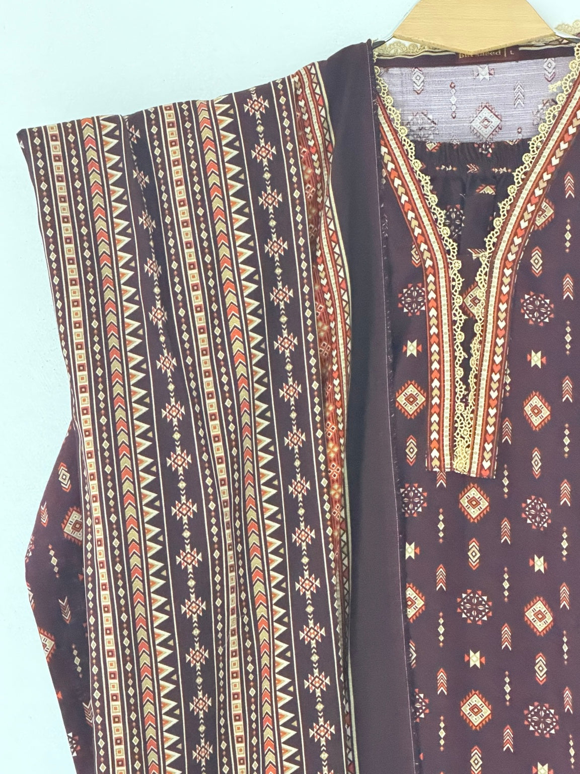 Bin Saeed Khaadar black rust geometric neckline and fabric detail