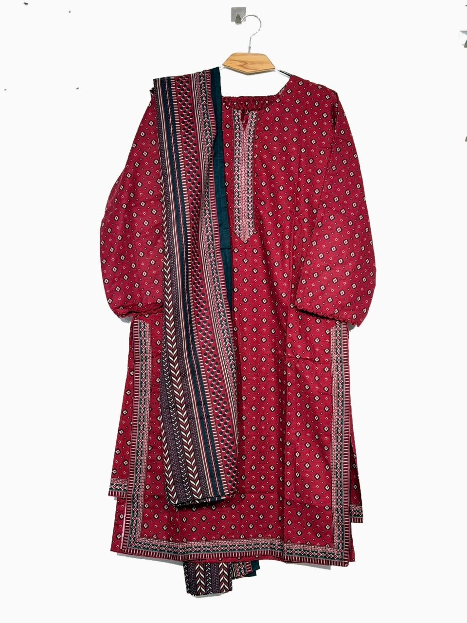 Polished full front product photo of Bin Saeed red and teal Khaddar 3-piece suit on original wooden hanger